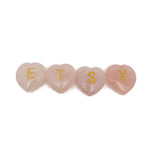 Rose quartz engraved crystal letter heart with personalized initial, gemstone decor by GemstoneGO, showcasing a polished, heart-shaped crystal.