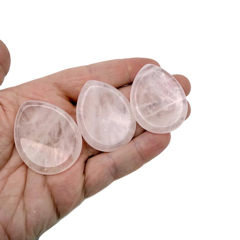 Rose quartz worry stone from GemstoneGO, a 45mm soothing crystal with polished surface and natural pink hue.