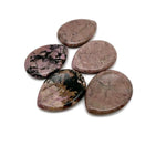 Rhodonite worry stone from GemstoneGO, 45mm soothing crystal with rounded shape and polished surface for meditation and stress relief.