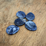 Sodalite worry stone from GemstoneGO, 45mm soothing crystal with polished blue and white mineral patterns.