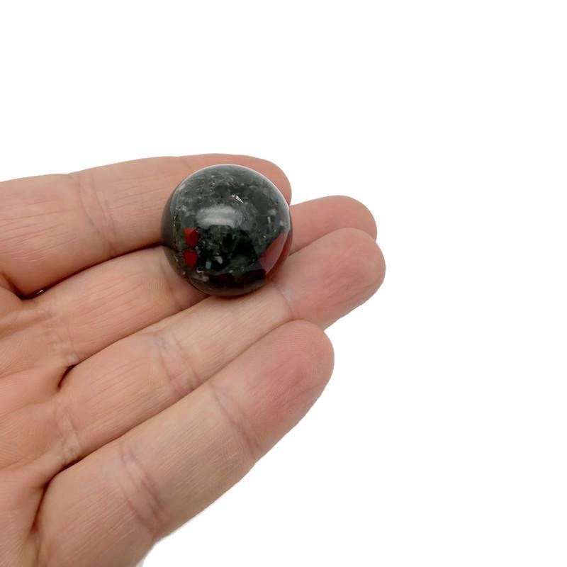 African Bloodstone sphere, 25mm crystal ball by GemstoneGO, showcasing deep green and red mineral patterns.