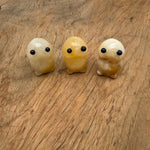 Yellow jade frog monster carved from gemstone, detailed handcrafted creature statue with vibrant yellow hues and intricate features.