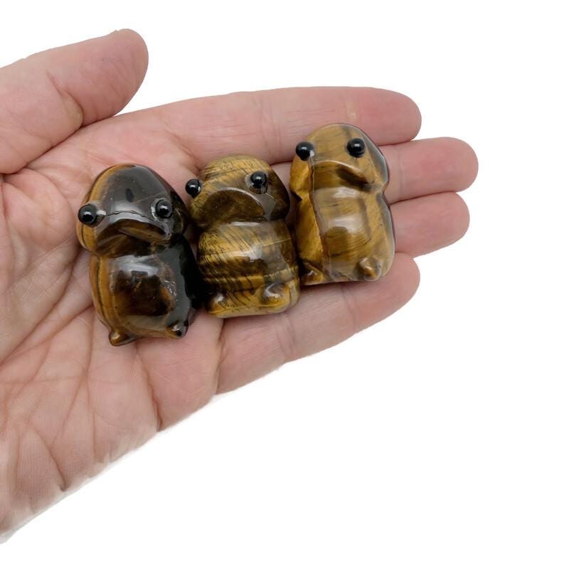 Handcrafted tiger eye frog gemstone carving, detailed creature statue with natural stone texture, from GemstoneGO.