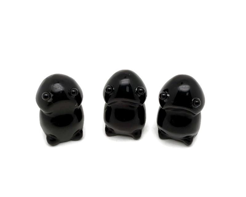Handcrafted obsidian frog monster gemstone carving, detailed creature statue from GemstoneGO with intricate features.