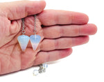 Healing crystal pendulum with stainless steel chain from GemstoneGO featuring a polished gemstone crystal for divination and energy healing.
