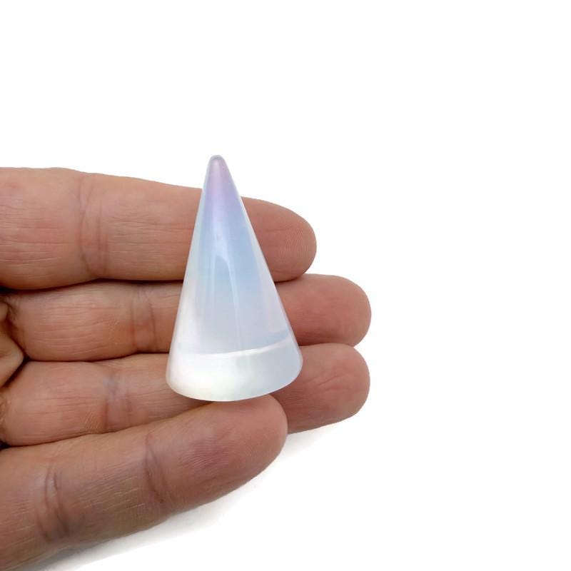 Carved gemstone cone ring holder display stand for jewelry, showcasing colorful gemstone accents and a stylish design.