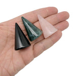 Carved gemstone cone ring holder displaying multiple rings on a jewelry display stand by GemstoneGO