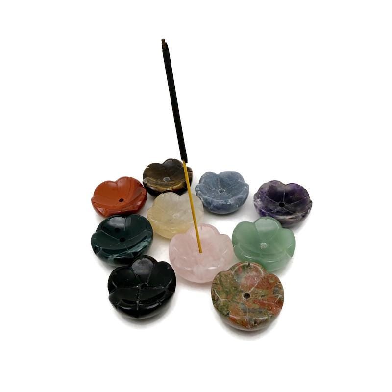 Crystal carving flower incense holder from GemstoneGO, designed for cleansing and relaxation, with intricate floral details.