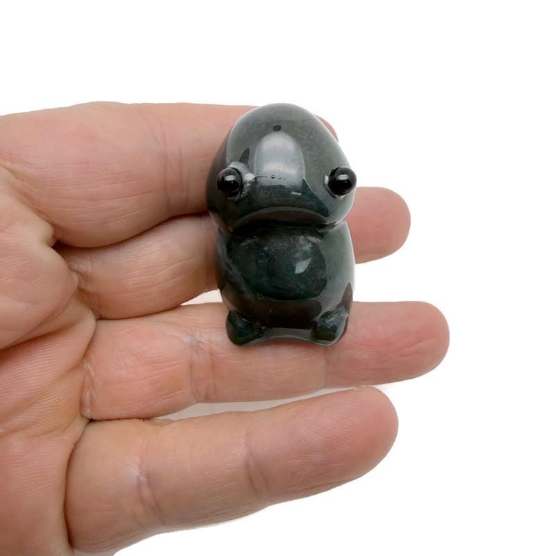 Handcrafted moss agate frog monster crystal carving, gemstone creature statue showcasing intricate details and vibrant green hues.