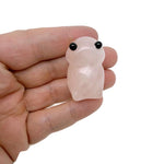 Handcrafted rose quartz frog monster gemstone carving, detailed creature statue with smooth polished surface and natural pink hue.