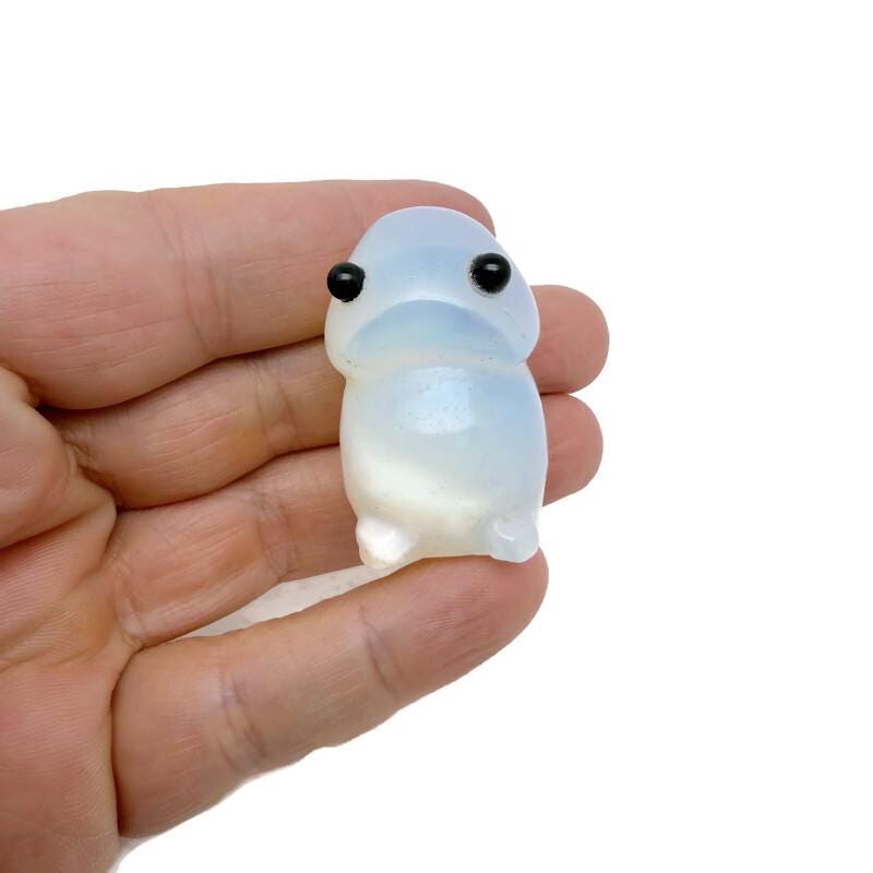 Opalite frog gemstone carving by GemstoneGO, a handcrafted creature statue with smooth, polished surface and vibrant blue glow.
