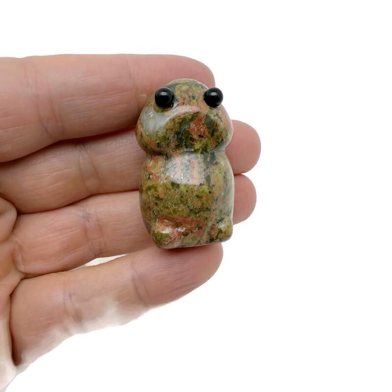 Handcrafted unakite frog monster gemstone carving, detailed creature statue made from colorful unakite gemstone.