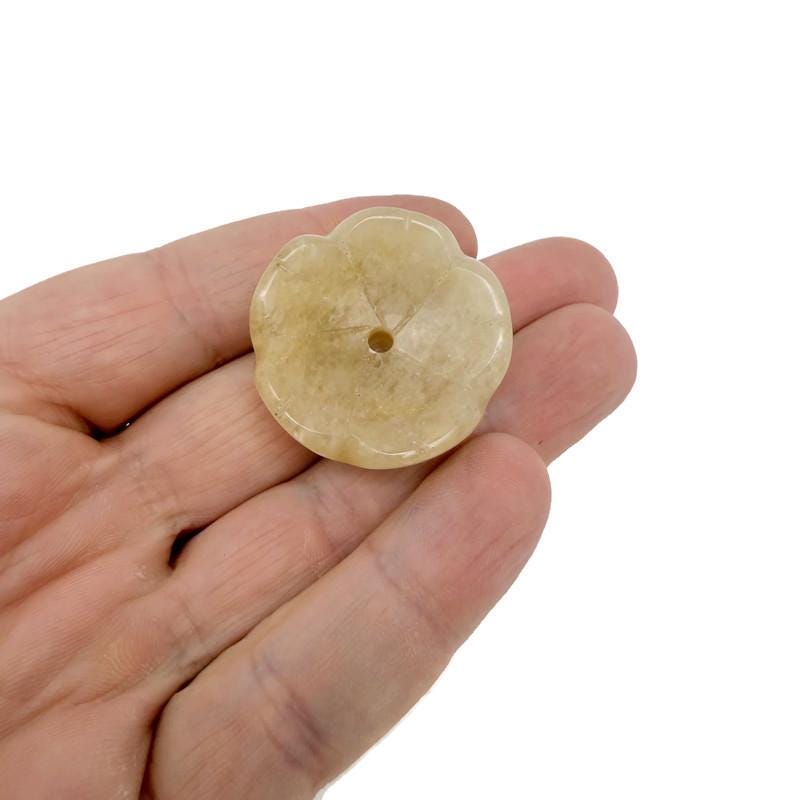 Yellow jade crystal flower-shaped incense holder with carved design, ideal for cleansing and relaxation.