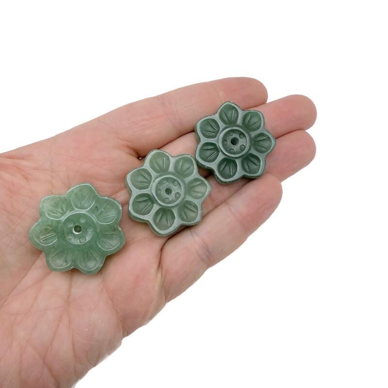 Aventurine natural crystal flower incense holder with carved gemstone design for meditation and incense stick burning.
