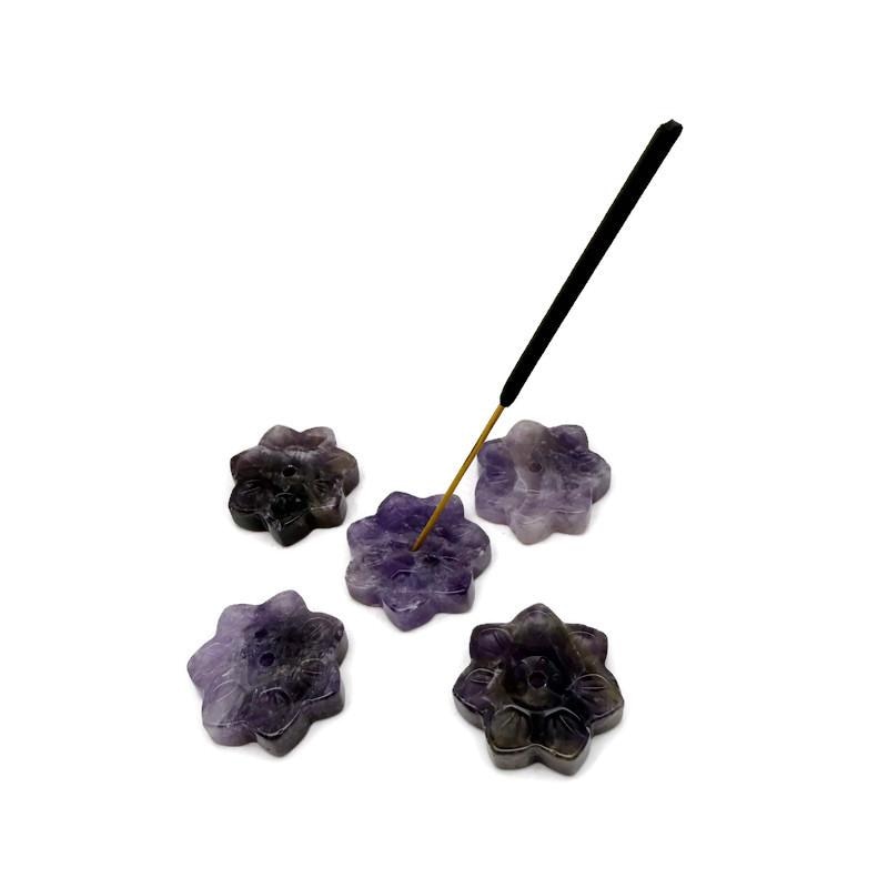 Amethyst natural crystal flower incense holder with carved gemstone design, used for meditation and burning incense sticks.