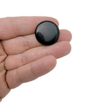 Round 25mm obsidian flat gemstone slab from GemstoneGO, showcasing smooth black volcanic stone with a polished finish.