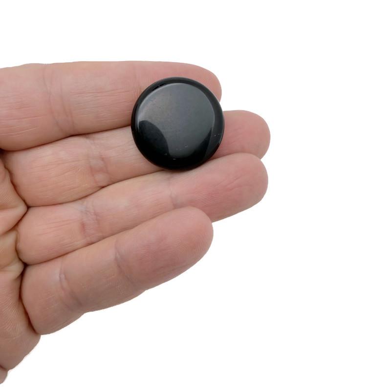Round 25mm obsidian flat gemstone slab from GemstoneGO, showcasing smooth black volcanic stone with a polished finish.