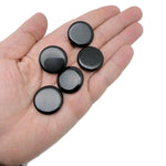 Round obsidian flat gemstone slab, 25mm, from GemstoneGO, showing smooth black polished surface with subtle reflective highlights.