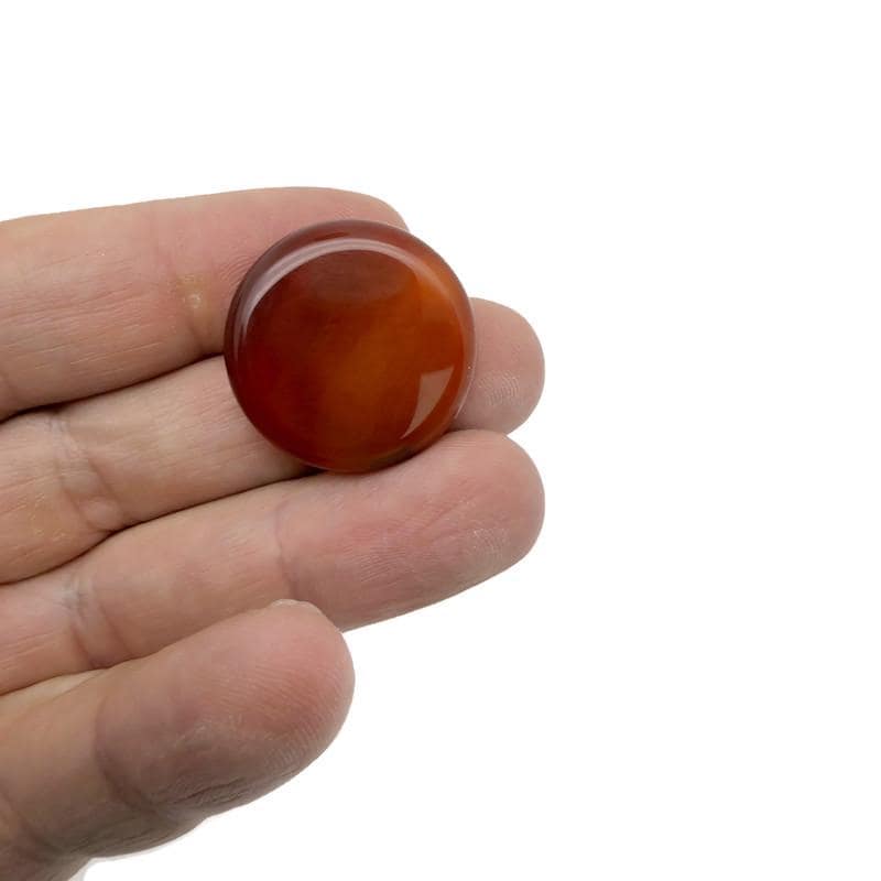 Round Carnelian flat gemstone slab, 25mm, from GemstoneGO, showing vibrant orange-red color and smooth polished surface.