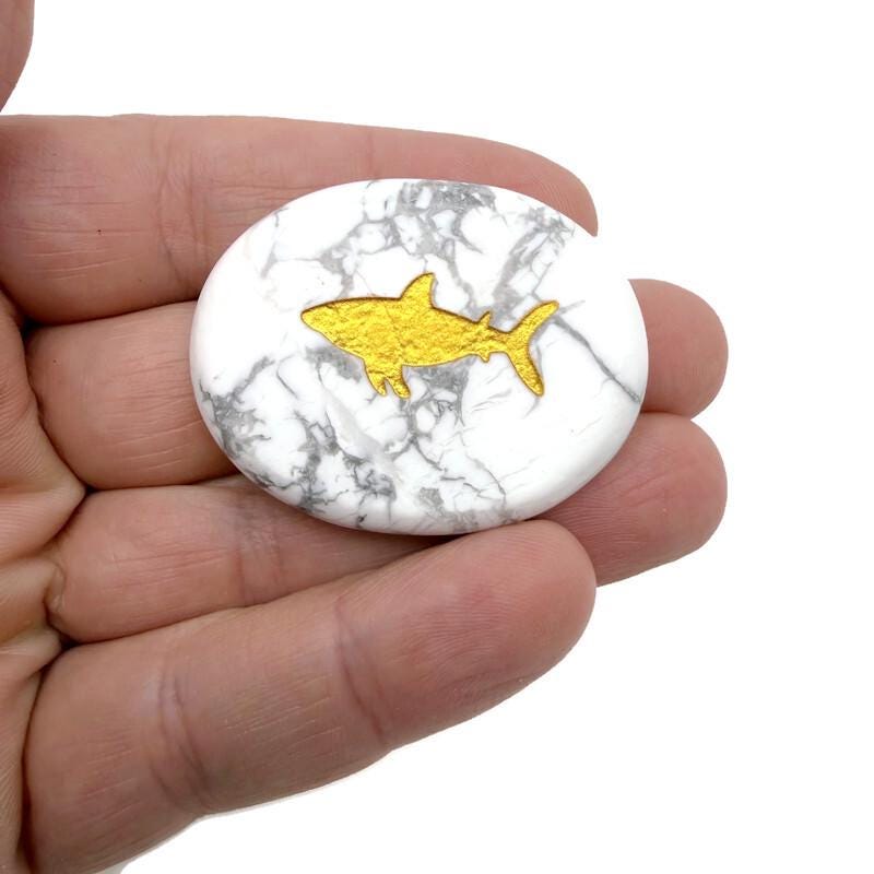 Gold crystal totem stone engraved with animal design, featuring a polished gemstone from GemstoneGO.