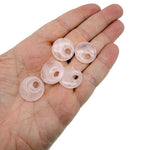 Pink rose quartz crystal donut pendant, 20mm Pi stone from GemstoneGO with a polished, smooth surface.