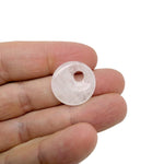 Clear Quartz Crystal donut pendant from GemstoneGO, 20mm Pi stone with polished, smooth surface and transparent, shiny appearance.