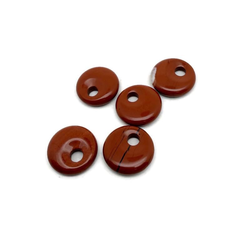 Red Jasper crystal donut pendant from GemstoneGO, 20mm Pi stone with rich red and earthy tones, smooth polished surface.
