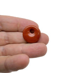 Red Jasper crystal donut pendant from GemstoneGO, 20mm Pi Stone with a vibrant red polished gemstone donut shape.
