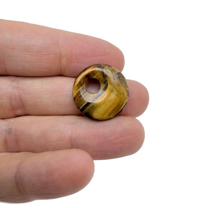 Tiger Eye Crystal Donut pendant, 20mm Pi Stone by GemstoneGO, showcasing the polished, golden-brown gemstone with distinctive chatoyancy.