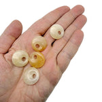 Yellow jade crystal donut pendant, 20mm Pi stone from GemstoneGO, smooth polished gemstone with a circular shape.