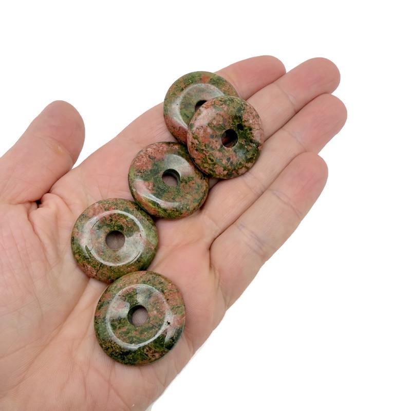 Unakite crystal donut pendant from GemstoneGO, 30mm Pi stone with vibrant green and pink mineral patterns.