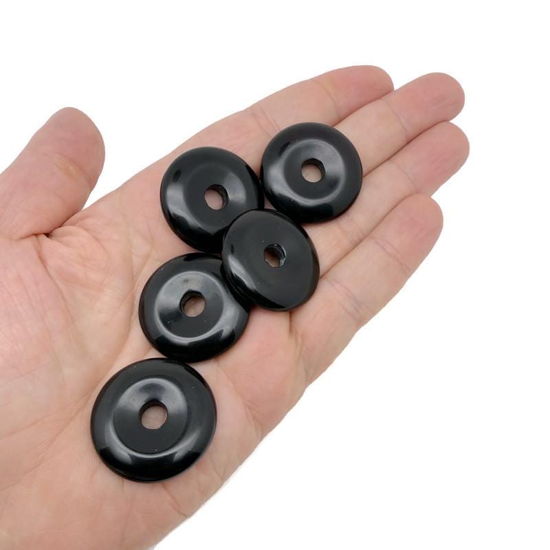 Polished 30mm Obsidian Crystal Donut pendant with natural black and glossy surface, from GemstoneGO.
