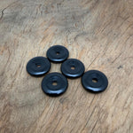 Obsidian crystal donut pendant from GemstoneGO, 30mm Pi stone with a smooth, polished black volcanic rock appearance.