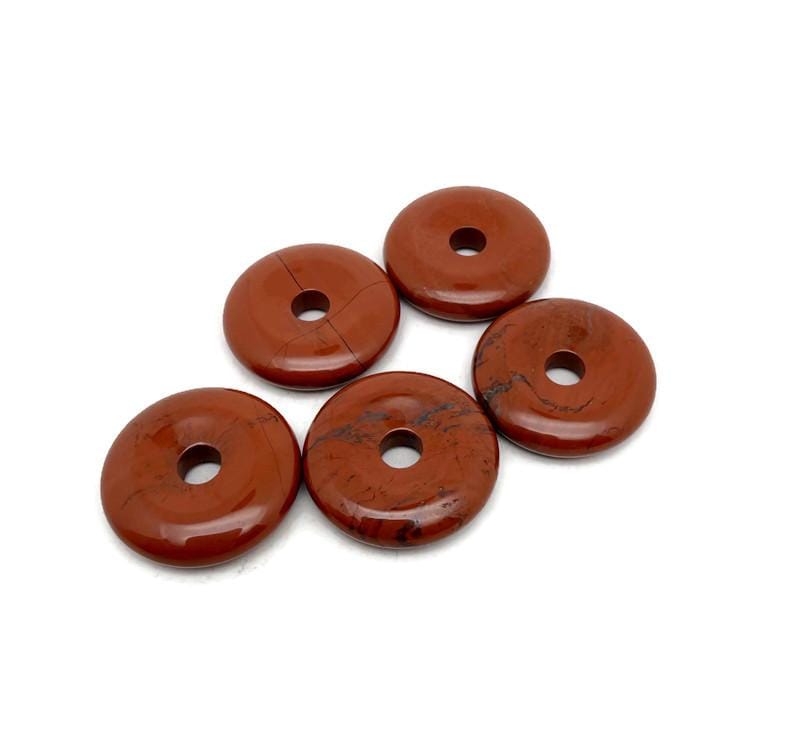Red Jasper crystal donut pendant from GemstoneGO, 30mm Pi stone with vibrant red color and polished smooth surface.