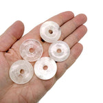 Clear Quartz Crystal Donut from GemstoneGO, 30mm Pi stone with smooth, polished surface and distinctive donut shape.