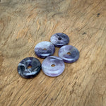Amethyst crystal donut pendant from GemstoneGO, 30mm Pi stone with purple gemstone and polished smooth surface.