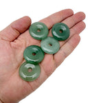 A 30mm Aventurine crystal donut pendant with natural green hues and unique stone patterns, crafted by GemstoneGO.