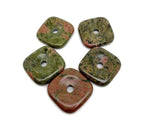Unakite square crystal donut gemstone from GemstoneGO, 30mm Pi stone with green and pinkish hues, polished and smooth surface.