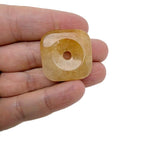 Yellow jade square crystal donut pendant, 30mm Pi stone from GemstoneGO, showcasing a polished yellow jade gemstone with a hole in the center.
