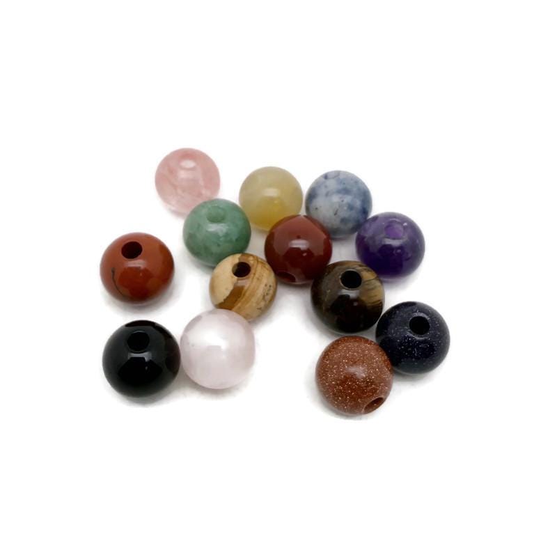 Round crystal beads from GemstoneGO, 12mm DIY jewelry making gemstone pack with a mix of colorful, faceted gemstone beads.
