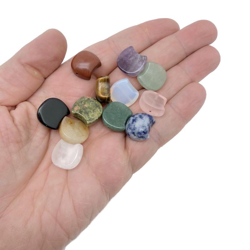 Assorted 16mm Crystal Moon Beads from GemstoneGO, perfect for jewelry making and craft projects, with a shiny, reflective surface.