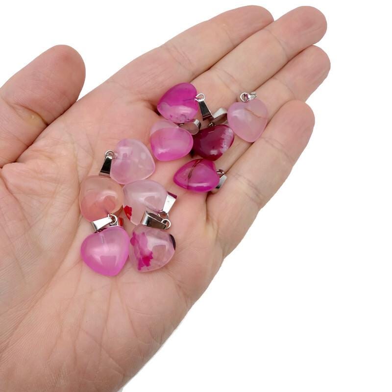 Pink agate heart pendant from GemstoneGO, featuring a mini crystal pendant with vibrant pink color and polished smooth surface.