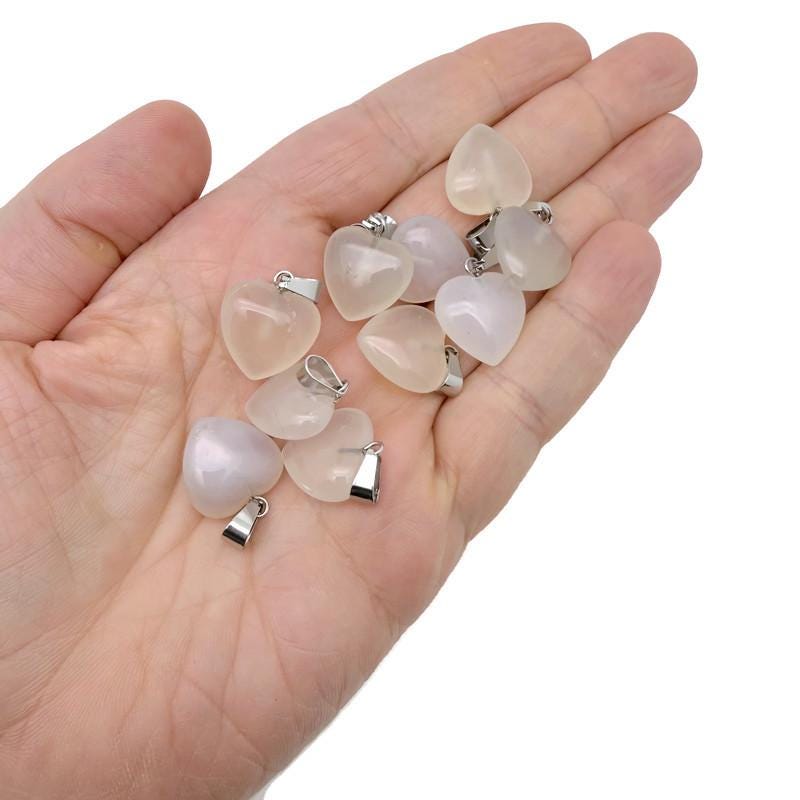 White agate heart pendant from GemstoneGO featuring a mini crystal pendant with a polished, smooth surface.