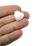 White jade heart pendant with mini crystal accent, gemstoneGO jewelry piece showcasing elegant, polished gemstone design