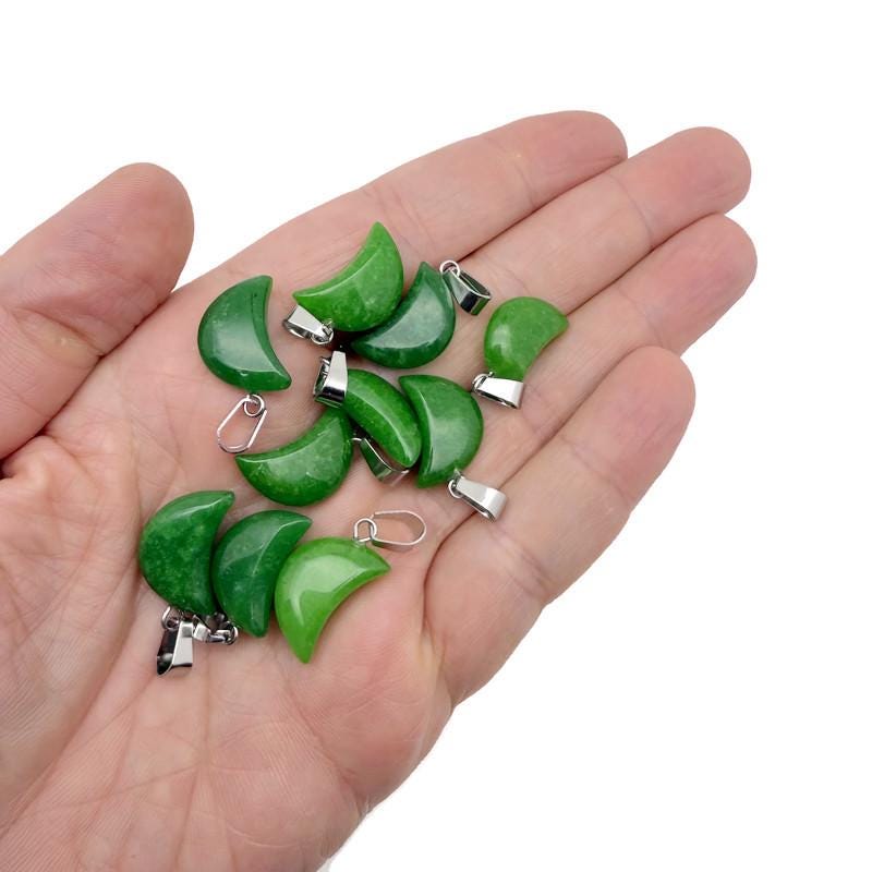 Green jade moon crystal pendant from GemstoneGO, showcasing a polished jade pendant shaped like a moon for jewelry making.