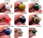 Apple-shaped crystal pendant from GemstoneGO, featuring healing gemstones and a polished, transparent crystal design.