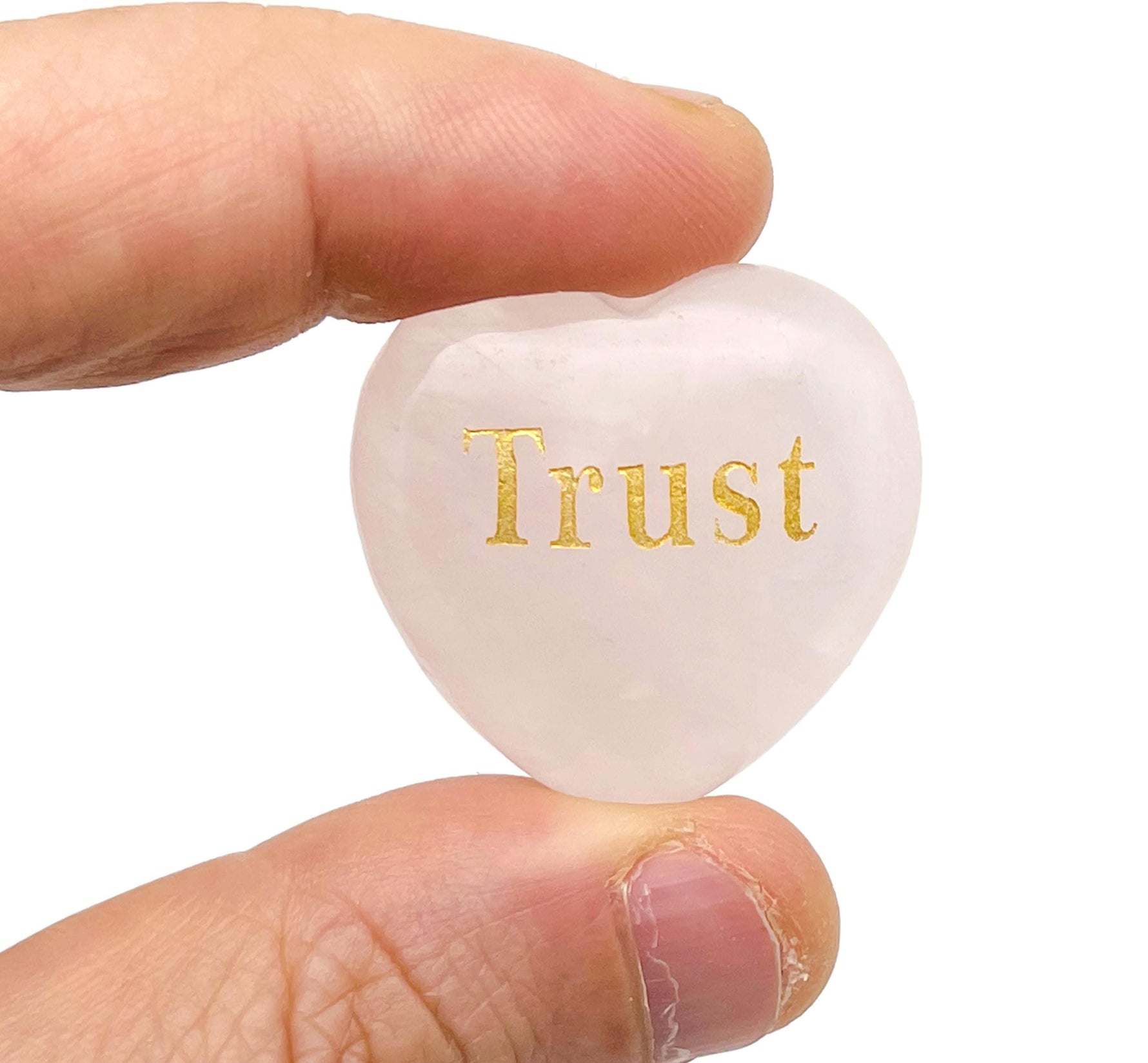 Rose Quartz heart engraved crystal by GemstoneGO, symbolizing love, trust, strength, kindness, and peace with detailed carving.