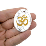 Crystal amulet featuring engraved Om symbol from GemstoneGO, drilled for spiritual insight and guidance.