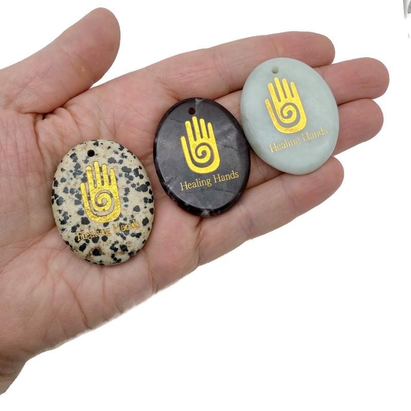 Healing Hands engraved crystal amulet by GemstoneGO, drilled energy healer gift pendant with intricate design and crystal clarity.