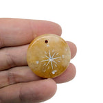 Engraved crystal compass pendant with drilled hole, ideal traveler gift by GemstoneGO, showcasing detailed craftsmanship on transparent crystal.